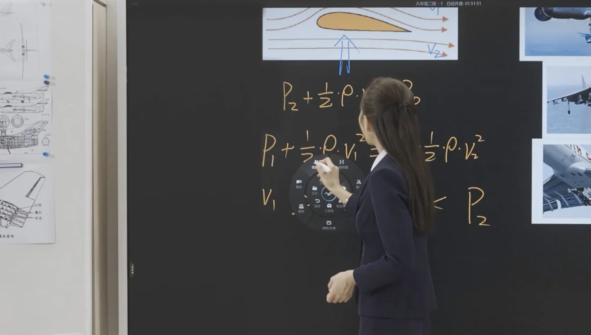 A teacher writes physics equations on a ClassIn Board beside a diagram of airflow over a wing.