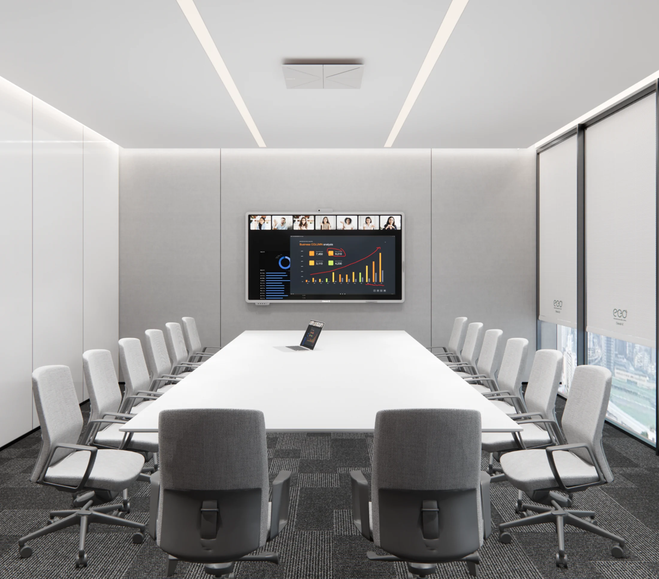 The Essential Demo Room at 65 Ubi Road: a long white table, grey chairs and one ClassIn screen on the far wall.